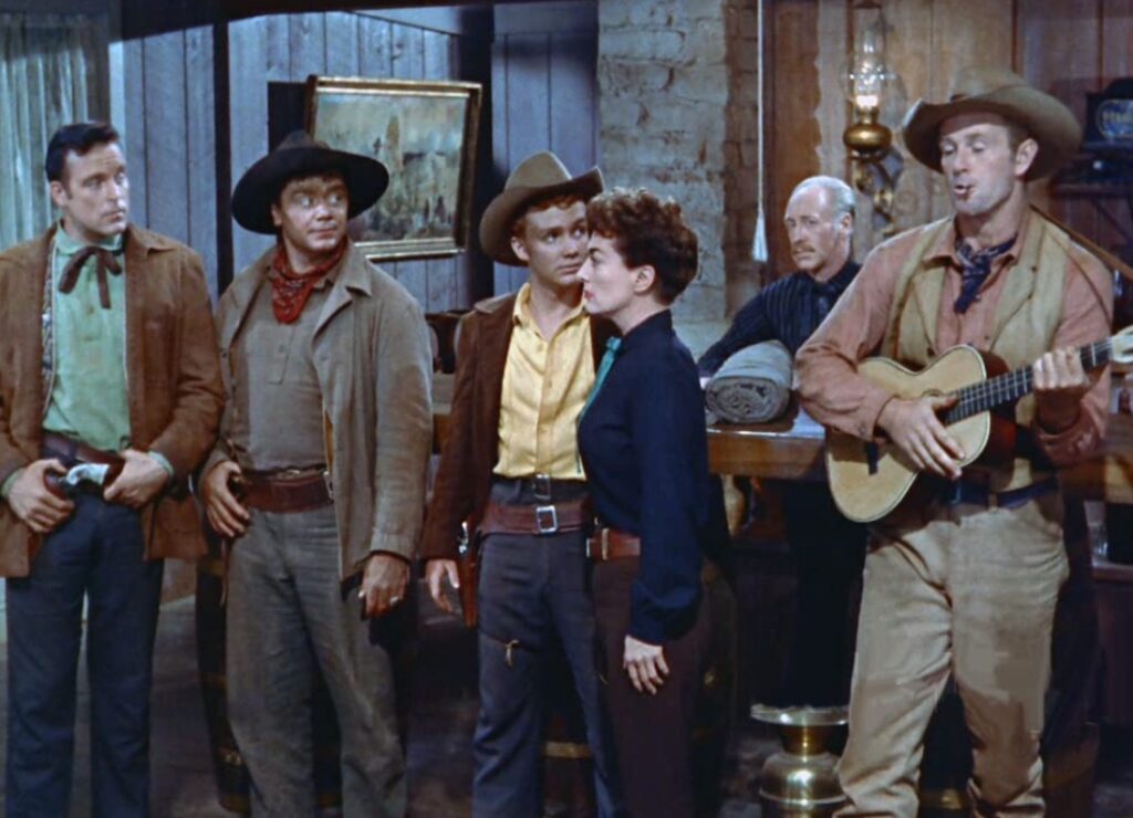 Nicholas Ray’in Dişi Kartal (Johnny Guitar) filmi, western türünü altüst eden radikal bir başyapıttır. Joan Crawford’un canlandırdığı Vienna karakteri, ataerkil düzene karşı özgürlüğün simgesine dönüşür. Film, McCarthy dönemi cadı avının alegorisi olarak da okunur.